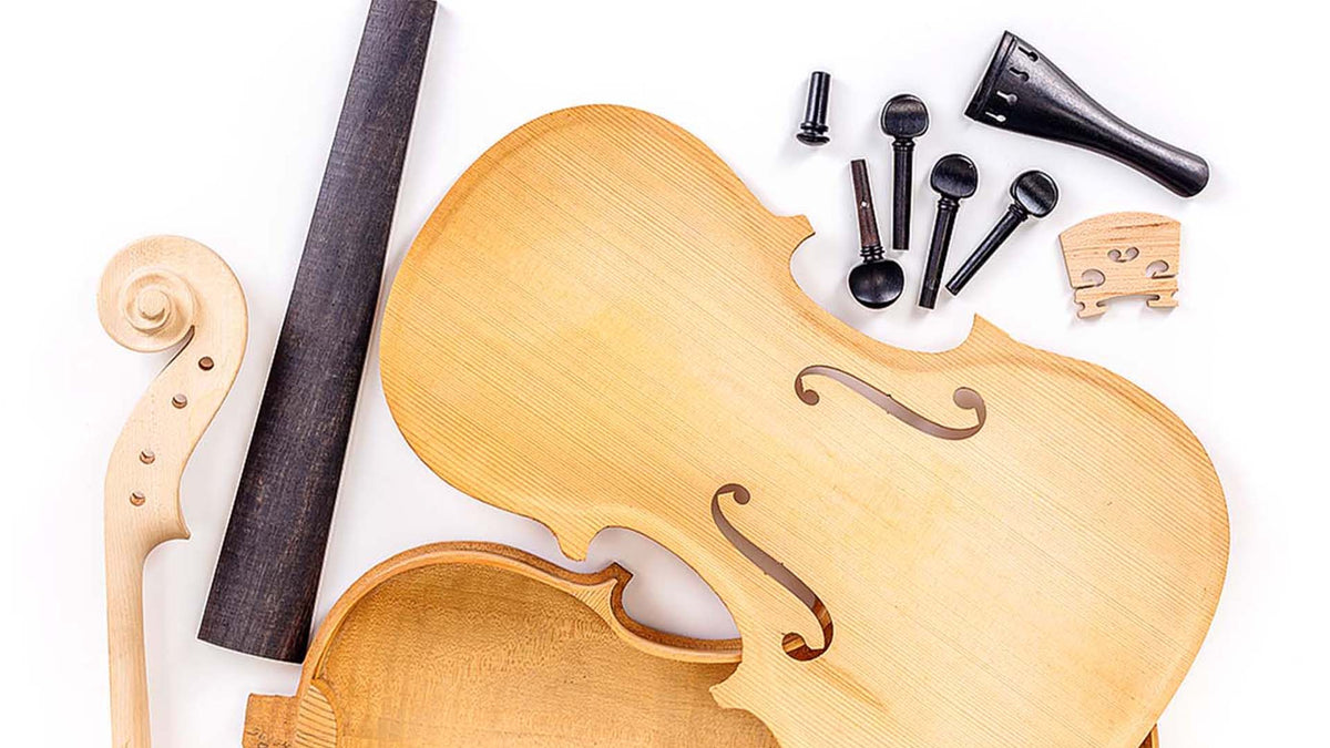 Violin parts including spruce top, scroll, fingerboard, pegs, tailpiece, and bridge