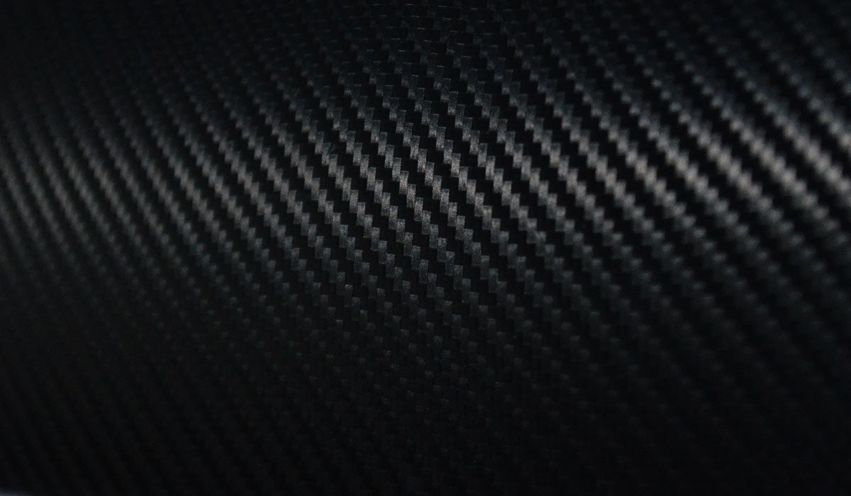 close up photo of a carbon fiber violin featuring a beautiful weave texture 