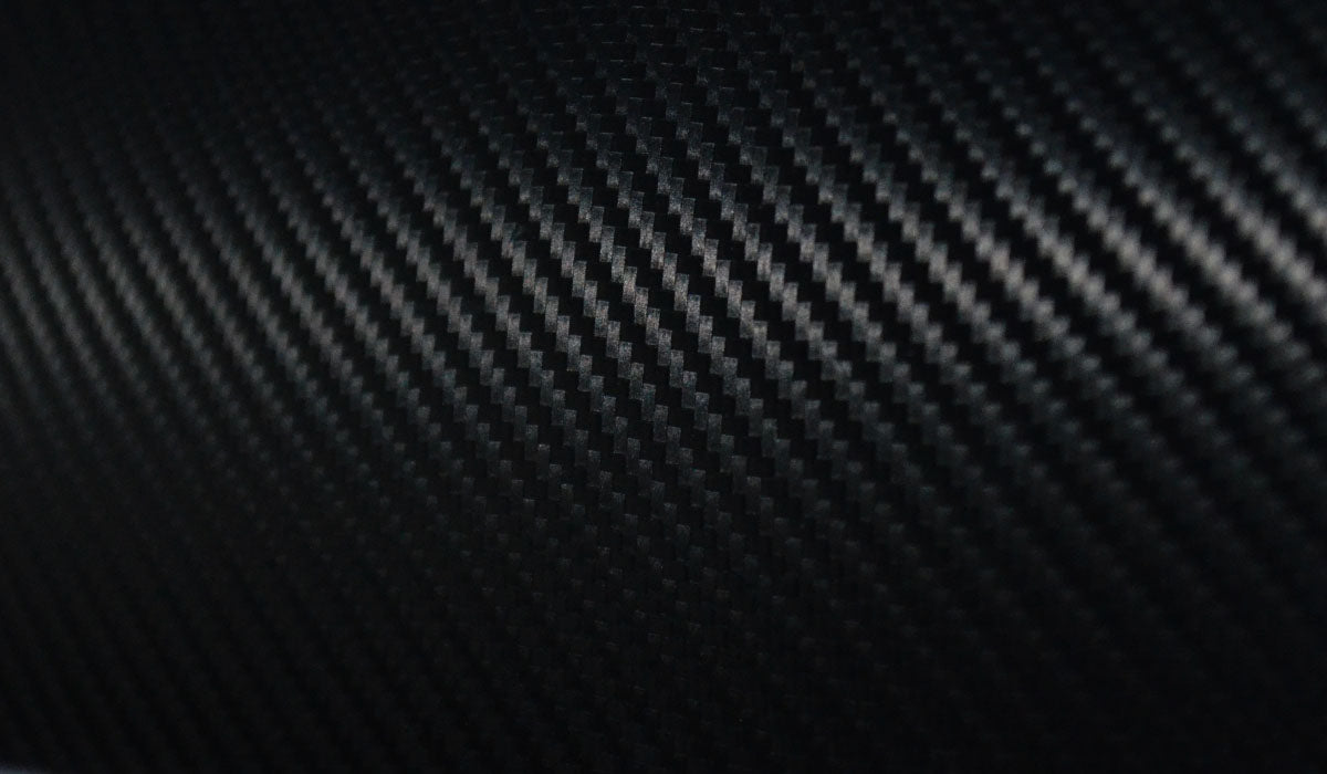 close up photo of a carbon fiber violin featuring a beautiful weave texture