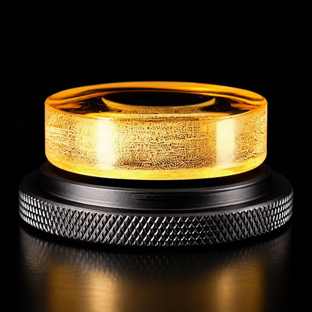 Close-up of Cecilia Artist Reserve Divinum Rosin featuring golden amber rosin mounted on a premium black metal holder with a textured grip.