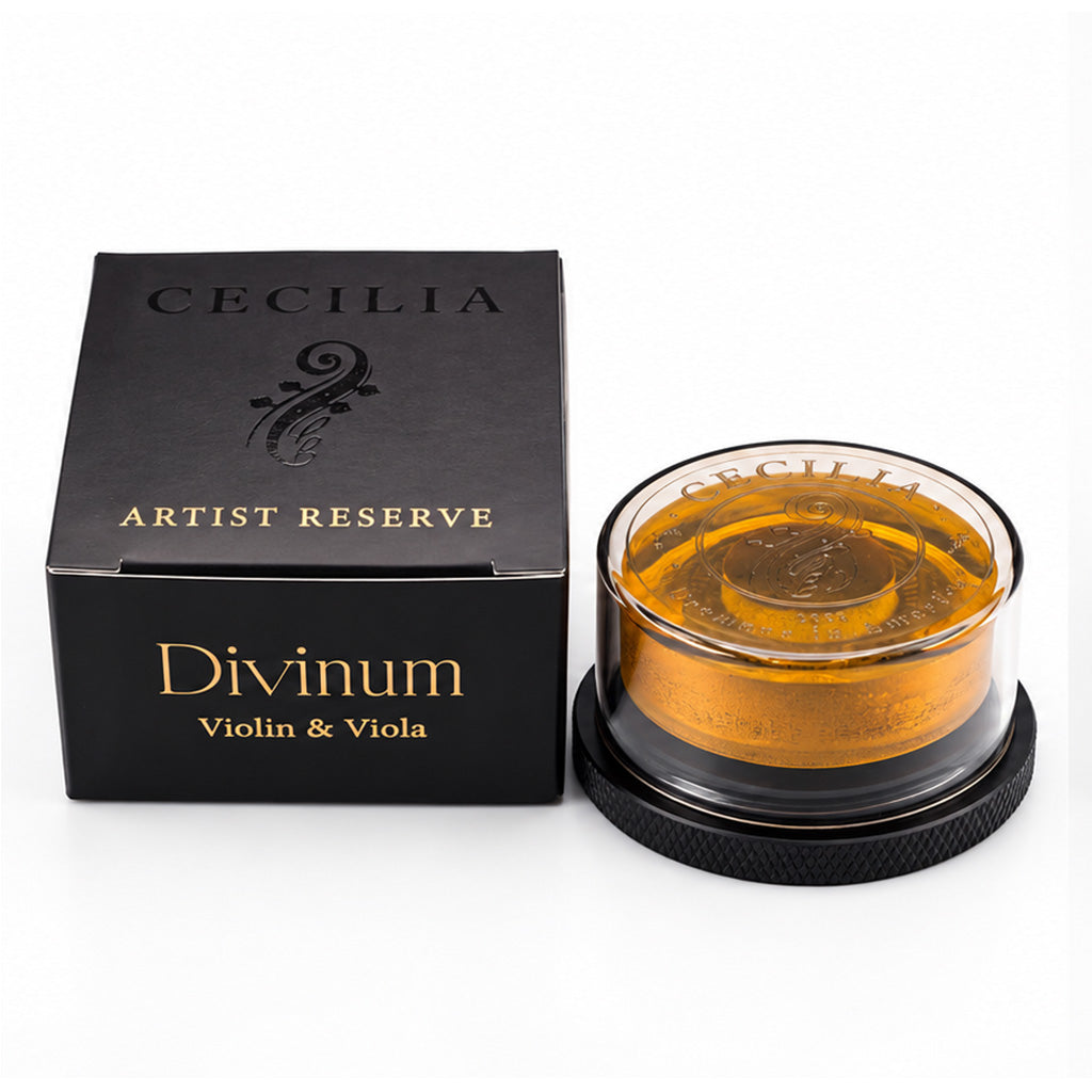 Cecilia Artist Reserve Divinum Violin and Viola Rosin with black and gold packaging and amber-colored rosin in a clear protective case.