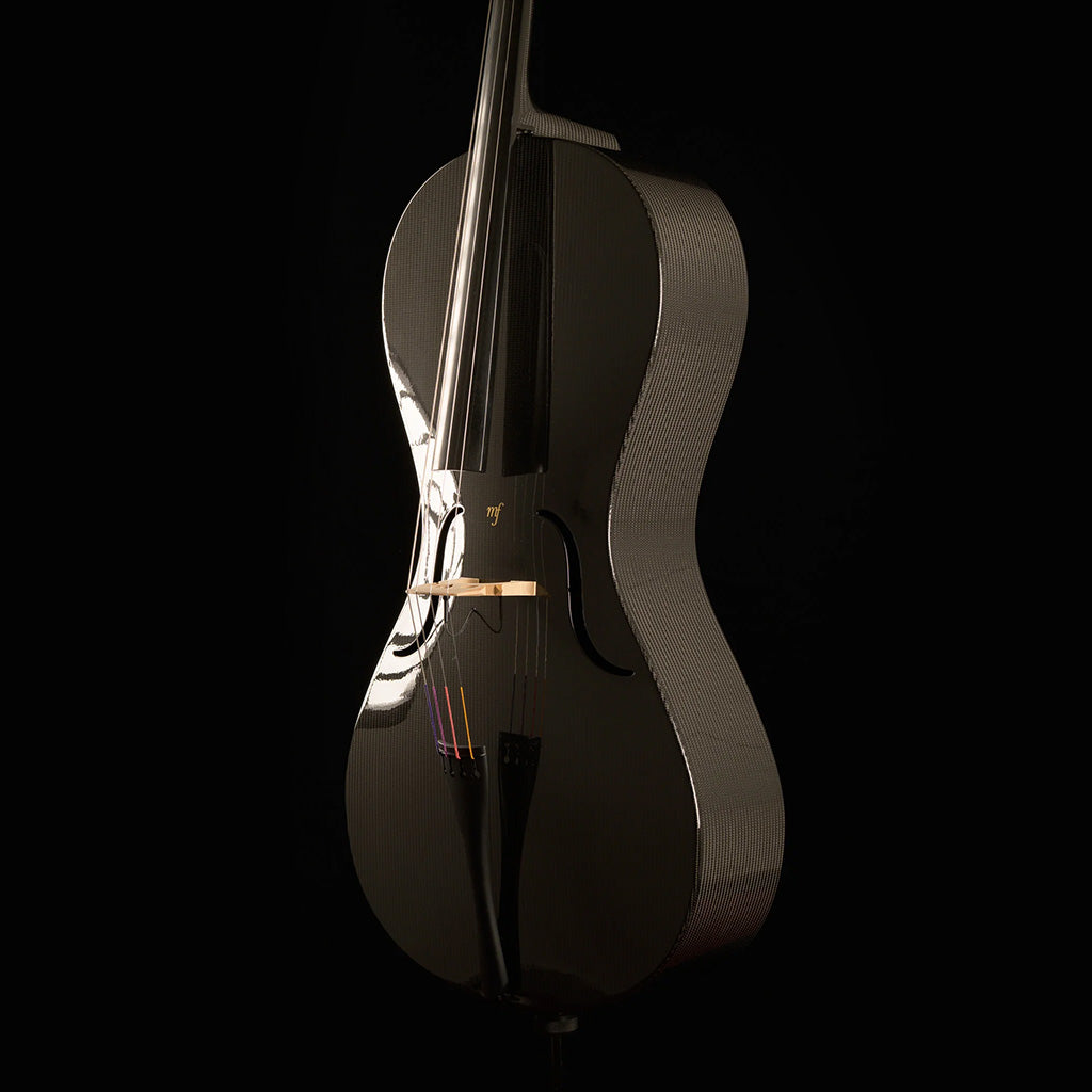 Three-quarter view of a Mezzo-Forte carbon fiber cello from the right, showing the woven carbon ribs, glossy top, and black tailpiece, on a black background.