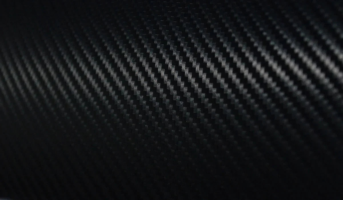 close up photo of a carbon fiber violin featuring a beautiful weave texture 