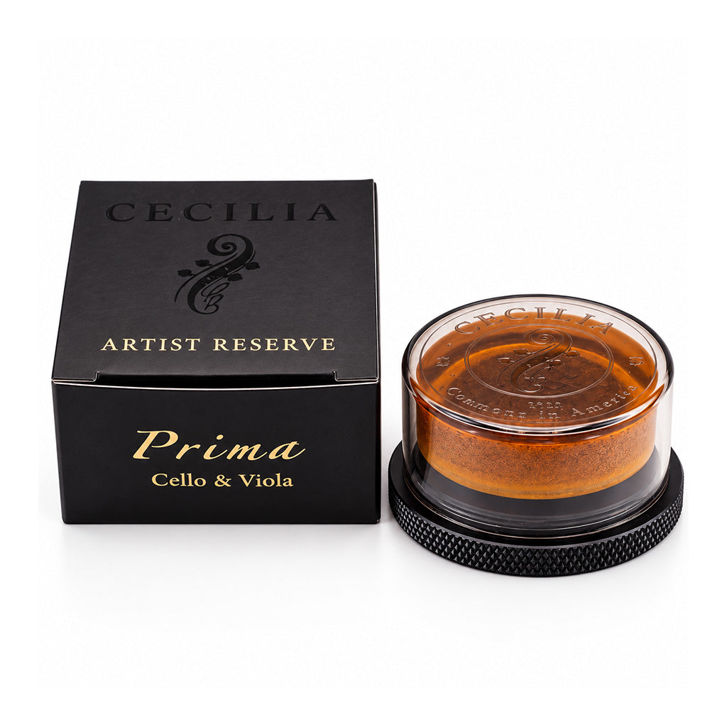 Cecilia Artist Reserve Prima Cello and Viola Rosin with premium black and gold packaging and amber-colored rosin in a protective case.