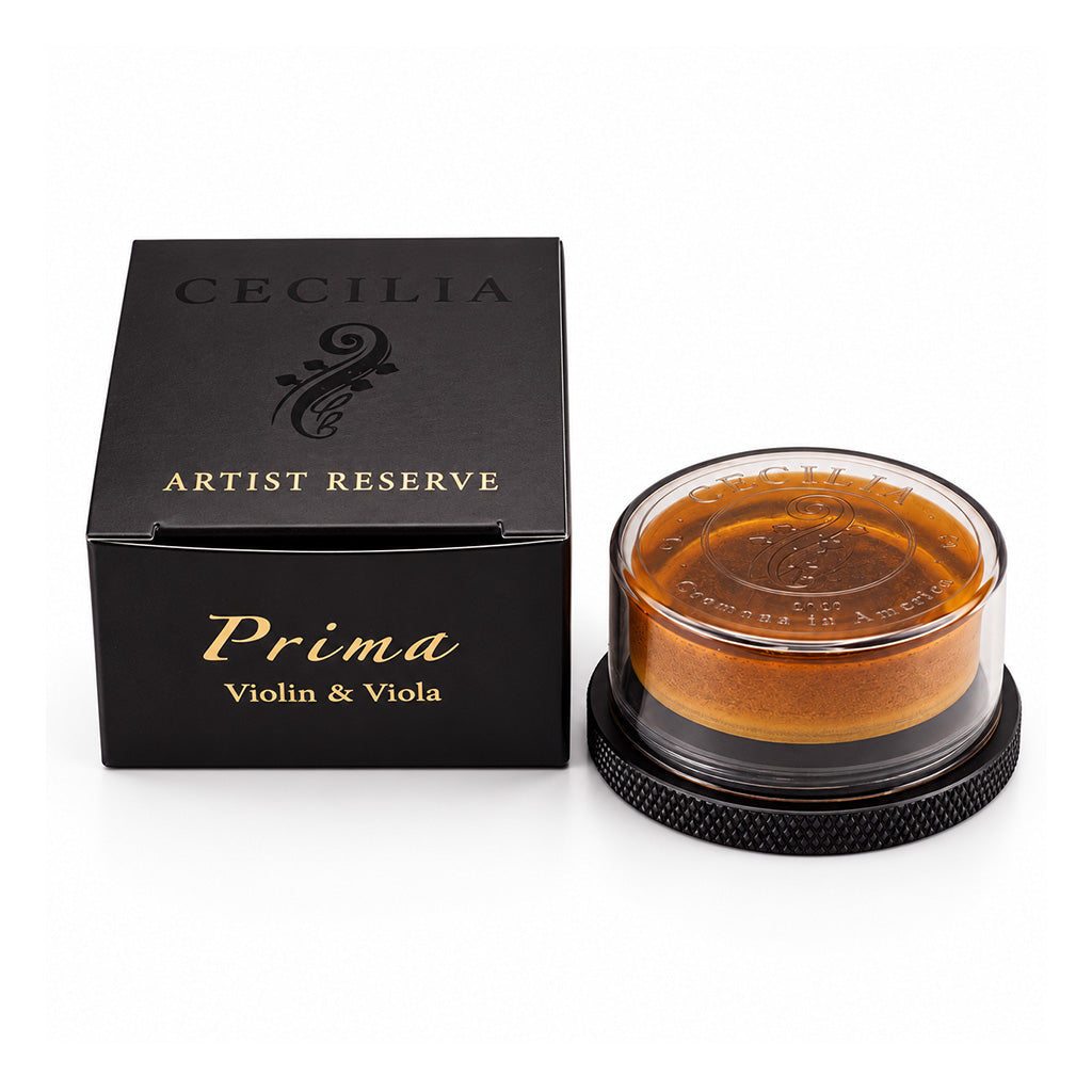 Cecilia Artist Reserve Prima Violin and Viola Rosin with premium black and gold packaging and amber-colored rosin in a protective case.